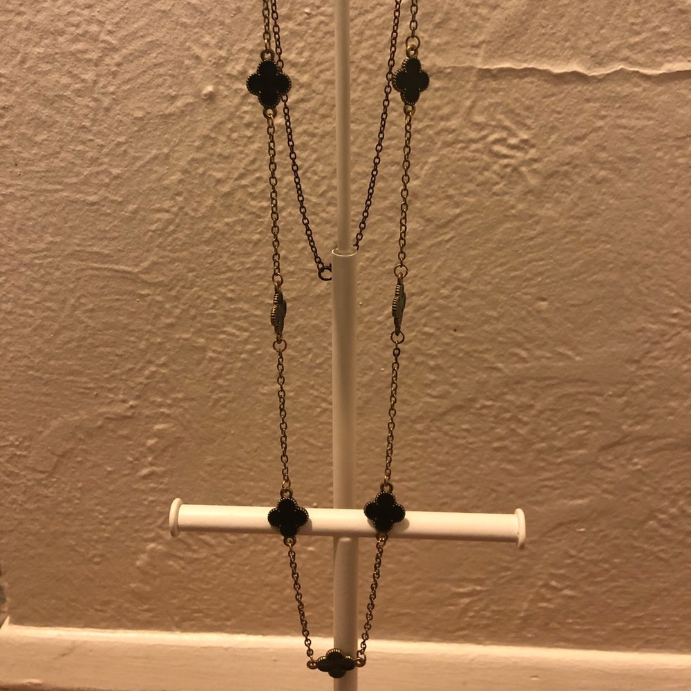 Gold necklace with black details